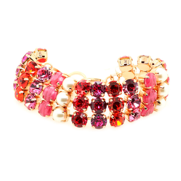 Image of wide, 3 strand bracelet featuring multicoloured crystals of red purple, fuchsia and faux pearls. Width: 3cm. 18ct Rose gold gilding.