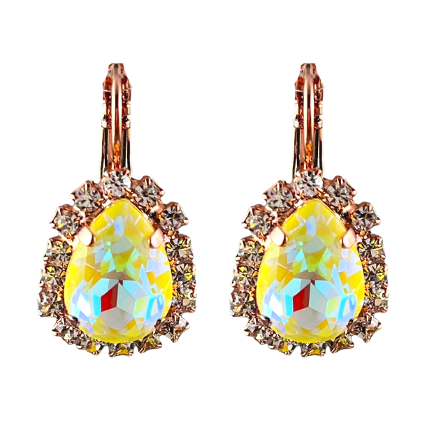 Image of iridized yellow crystal teardrop shaped earrings surrounded with diamond seed crystals on a French hook. Rose gold plated metal.