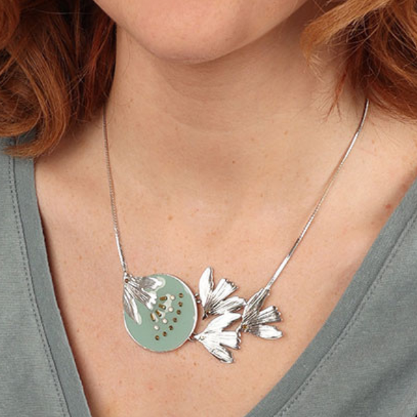 Image of model wearing pretty necklace using birds as feature with hand painted blue resin and rhinestones on silver plated finish.