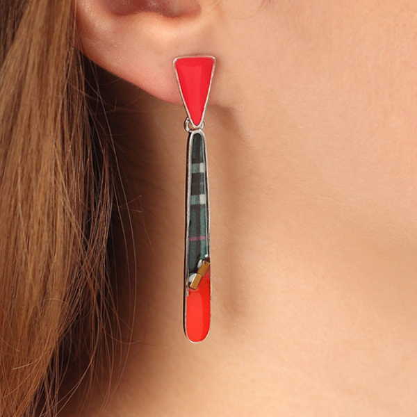 Image of model wearing long multi coloured slender dangle stud earrings.